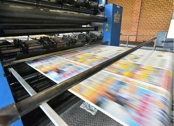 Industrial printer releasing vibrant pages
